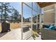 Relaxing screened porch with comfortable seating and views of the well-maintained backyard at 1487 Lanterns Rest Rd. # 4, Myrtle Beach, SC 29579