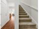 Carpeted staircase and entryway with views to an open floor plan, leading to the upper level at 1487 Lanterns Rest Rd. # 4, Myrtle Beach, SC 29579