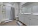 Bathroom with a double sink vanity, walk-in shower, and tile flooring at 177 Fox Rae Dr., Conway, SC 29526