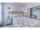 This bedroom features carpet flooring, a queen-size bed with decorative pillows, and a rustic nightstand at 177 Fox Rae Dr., Conway, SC 29526