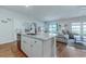 Stylish kitchen island with granite countertops, stainless steel dishwasher, and open view to living area at 177 Fox Rae Dr., Conway, SC 29526