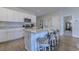 Charming kitchen island with bar seating, white cabinetry, and stainless steel appliances at 177 Fox Rae Dr., Conway, SC 29526