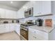 Modern kitchen featuring stainless steel appliances, white cabinets, and granite countertops at 177 Fox Rae Dr., Conway, SC 29526