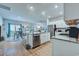 Open concept kitchen with stainless steel appliances, island, and seamless flow to living area at 177 Fox Rae Dr., Conway, SC 29526