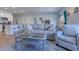 An inviting living room featuring modern decor, open to the kitchen with counter seating, and a comfortable couch at 177 Fox Rae Dr., Conway, SC 29526