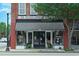 Charming bakery café storefront featuring a striped awning, large windows, and inviting entrance in a brick building at 177 Fox Rae Dr., Conway, SC 29526