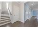 Upstairs hallway featuring wood floors, stairs, and doors at 1808 Zodiac Court, Myrtle Beach, SC 29577