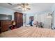 Bedroom with blue walls, wood-look flooring, a ceiling fan, and natural light from the window at 1917 Candy Ln., Surfside Beach, SC 29575
