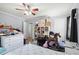 Bedroom with light grey walls, wood-look flooring, and a five blade fan at 1917 Candy Ln., Surfside Beach, SC 29575