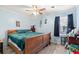 Bedroom with light blue walls, wood-look flooring, and a full size bed at 1917 Candy Ln., Surfside Beach, SC 29575