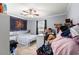 Bedroom with light grey walls, wood-look flooring, and a sun tapestry at 1917 Candy Ln., Surfside Beach, SC 29575