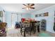 Cozy dining area featuring a ceiling fan, wood-look floors and natural light at 1917 Candy Ln., Surfside Beach, SC 29575