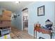 Hallway featuring wood-look flooring, blue walls with white trim, and doorways leading to other rooms in the home at 1917 Candy Ln., Surfside Beach, SC 29575