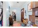 Hallway features wood-look floors, light blue walls, white trim, and a glimpse into other areas, conveying a lived-in space at 1917 Candy Ln., Surfside Beach, SC 29575