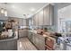 Well-lit kitchen featuring gray cabinets, and ample counter space at 1917 Candy Ln., Surfside Beach, SC 29575