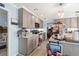 Well-lit kitchen with gray cabinets, center island, and modern appliances at 1917 Candy Ln., Surfside Beach, SC 29575