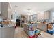 Well-lit kitchen with gray cabinets, center island, and modern appliances at 1917 Candy Ln., Surfside Beach, SC 29575