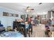 Open-concept kitchen and dining area with wood-look flooring and ample light at 1917 Candy Ln., Surfside Beach, SC 29575
