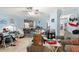 Inviting living room with a ceiling fan, light blue walls, and natural light at 1917 Candy Ln., Surfside Beach, SC 29575