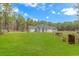 A large, well-maintained lawn surrounds this home, offering plenty of space and serene outdoor living at 1930 W Homewood Rd., Conway, SC 29526