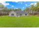 Well-maintained backyard with lush lawn, mature trees, and a charming patio area, perfect for outdoor gatherings at 1930 W Homewood Rd., Conway, SC 29526
