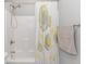 Bright bathroom features a shower and tub combination, modern fixtures, and a stylish shower curtain at 1930 W Homewood Rd., Conway, SC 29526