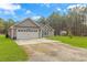View of a well-kept home with gray siding, a two-car garage, and a lush green lawn at 1930 W Homewood Rd., Conway, SC 29526