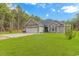 Charming single-story home with an attached two-car garage, manicured lawn, and well-maintained landscaping at 1930 W Homewood Rd., Conway, SC 29526