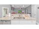 Bright kitchen featuring a double sink, granite countertops, and white cabinets at 1930 W Homewood Rd., Conway, SC 29526