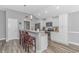 Open concept kitchen with bar seating, granite countertops, and modern appliances at 1930 W Homewood Rd., Conway, SC 29526