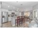Bright kitchen with white cabinets, granite countertops, stainless steel appliances, and an adjacent dining area at 1930 W Homewood Rd., Conway, SC 29526