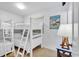 Bright and airy bedroom with white bunk beds and a simple, clean design at 200 N Waccamaw Dr. # 3F, Murrells Inlet, SC 29576