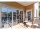 This balcony features a tan floor, ceiling fan and furniture with a beautiful view at 2180 Waterview Dr. # 727, North Myrtle Beach, SC 29582