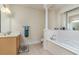 Well-lit bathroom featuring double vanity, soaking tub, and classic fixtures at 2180 Waterview Dr. # 727, North Myrtle Beach, SC 29582