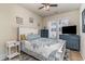 Cozy bedroom with a queen-sized bed, patterned bedding, and dresser storage, and a ceiling fan at 2180 Waterview Dr. # 727, North Myrtle Beach, SC 29582