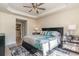 Cozy bedroom featuring a ceiling fan, tray ceilings, and coordinated decor at 2180 Waterview Dr. # 727, North Myrtle Beach, SC 29582