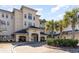 Inviting condo exterior with a brick drive, lush landscaping, and a charming entrance beneath a covered archway at 2180 Waterview Dr. # 727, North Myrtle Beach, SC 29582