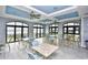 Bright dining area with large windows offering scenic views, perfect for gatherings at Barefoot Resort at 2180 Waterview Dr. # 727, North Myrtle Beach, SC 29582