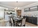 Elegant dining room with stylish seating, table decor, and a view into the modern kitchen space at 2180 Waterview Dr. # 727, North Myrtle Beach, SC 29582