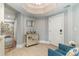 Hallway view with tiled floors, a decorative cabinet, mirror, and a glimpse into the home's elegant interior at 2180 Waterview Dr. # 727, North Myrtle Beach, SC 29582