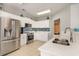 Bright kitchen featuring white cabinets, stainless steel appliances, tile backsplash, and ample counter space at 2180 Waterview Dr. # 727, North Myrtle Beach, SC 29582