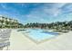 Relaxing pool area with chairs, and well-manicured landscaping within the beautiful Barefoot Resort community at 2180 Waterview Dr. # 727, North Myrtle Beach, SC 29582