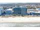 Aerial view of a large condo building next to the ocean at 2401 S Ocean Blvd. # 971, Myrtle Beach, SC 29577