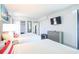 Modern bedroom featuring two beds, closet, dresser, and TV for optimal comfort at 2401 S Ocean Blvd. # 971, Myrtle Beach, SC 29577