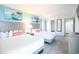 Bright bedroom featuring two beds, stylish headboards, closet, ocean-themed art, and neutral decor at 2401 S Ocean Blvd. # 971, Myrtle Beach, SC 29577