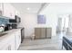 Modern kitchen area with sleek appliances, beautiful backsplash, and a view into the dining area at 2401 S Ocean Blvd. # 971, Myrtle Beach, SC 29577