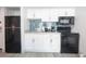 Modern kitchen featuring stainless steel appliances, white cabinetry, backsplash, and countertop at 2401 S Ocean Blvd. # 971, Myrtle Beach, SC 29577