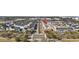 Aerial view of townhomes, tree-lined streets, sidewalks, and street parking in a well-planned community at 2794 Howard Ave. # D, Myrtle Beach, SC 29577