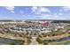 Ariel view of townhomes in a planned community with a waterway, trees, and various amenities at 2794 Howard Ave. # D, Myrtle Beach, SC 29577