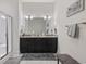 Bathroom features a double vanity with dark cabinets and a granite countertop at 2794 Howard Ave. # D, Myrtle Beach, SC 29577